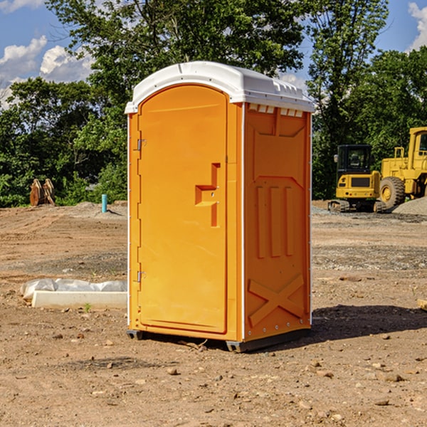 what is the cost difference between standard and deluxe portable restroom rentals in Vesta